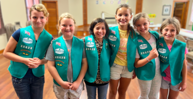 Six Girl Scout members pose for a photo.