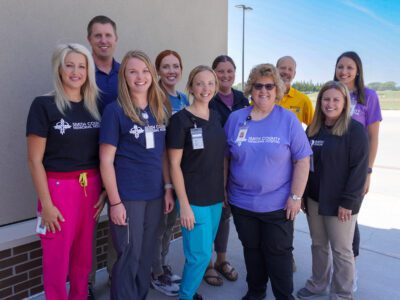 Sarah Ragsdale poses with the Rehab Services team. 